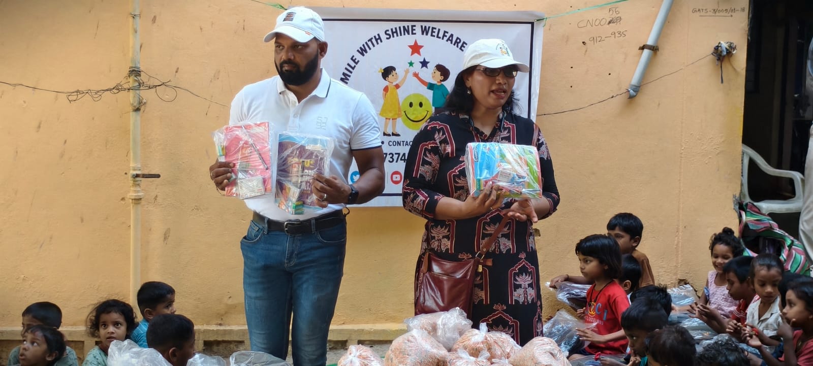 Educational kit being placed in the hands of an underprivileged child
