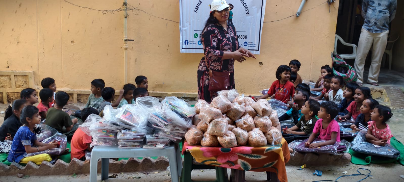 Parents and children expressing gratitude after receiving educational kits