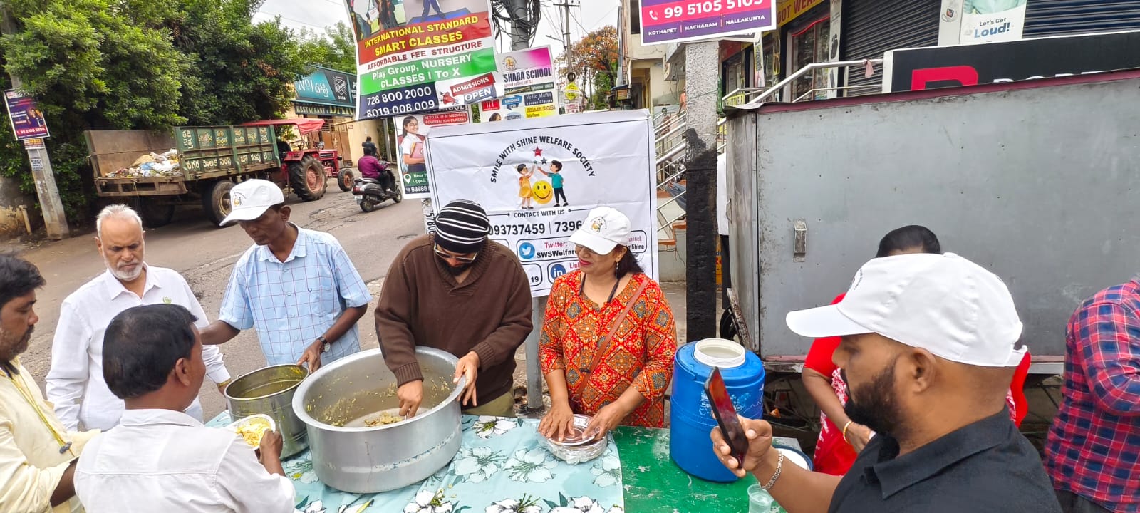Daily wage workers at a Hyderabad coolie adda receiving warm breakfast