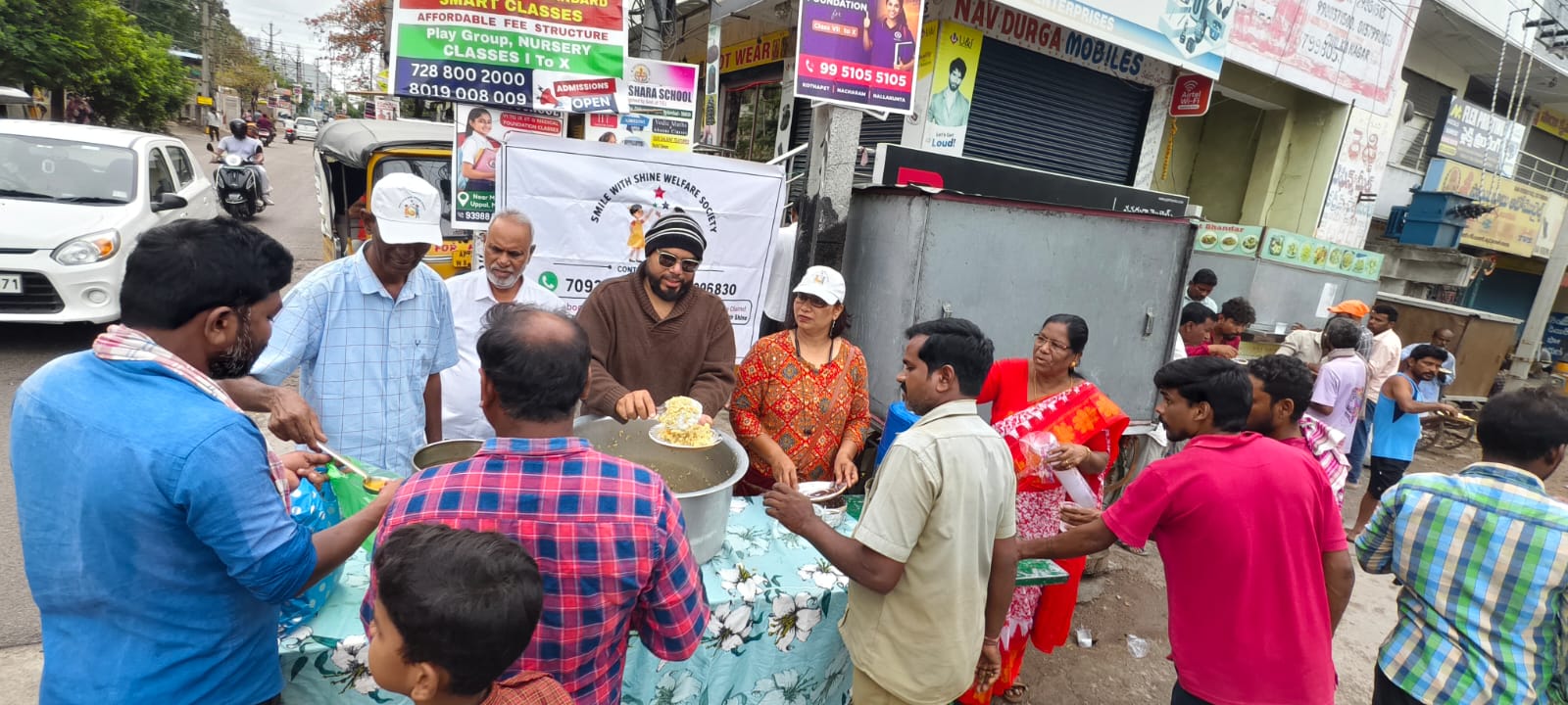 Smile With Shine Welfare Society founder Smt. Grace Mani serving a warm breakfast to a homeless man on a Hyderabad roadside