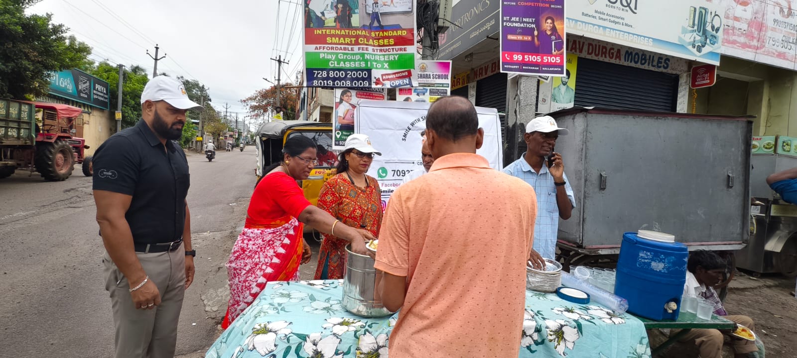 Daily wage workers waiting on a Hyderabad street as the breakfast drive arrives
