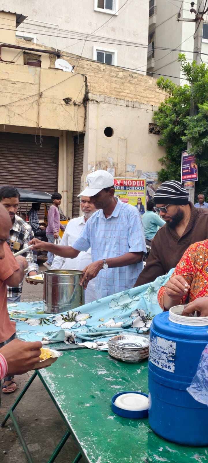 Food containers and water being prepared at the start of the breakfast drive