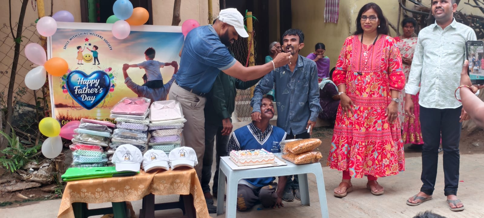 A father blessing the Smile With Shine team after receiving his Father's Day gifts