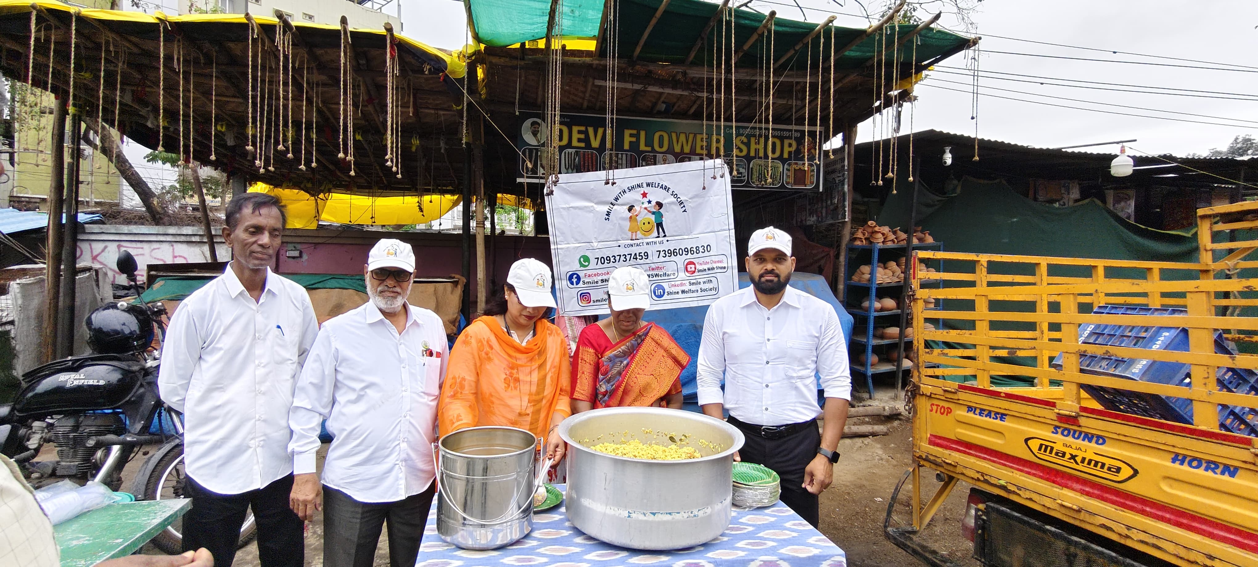 A wider view of the Smile With Shine Welfare Society Tuesday breakfast drive serving line on the streets of Hyderabad on July 21, 2026